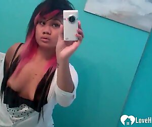 Asian with pink hair posing without her panties